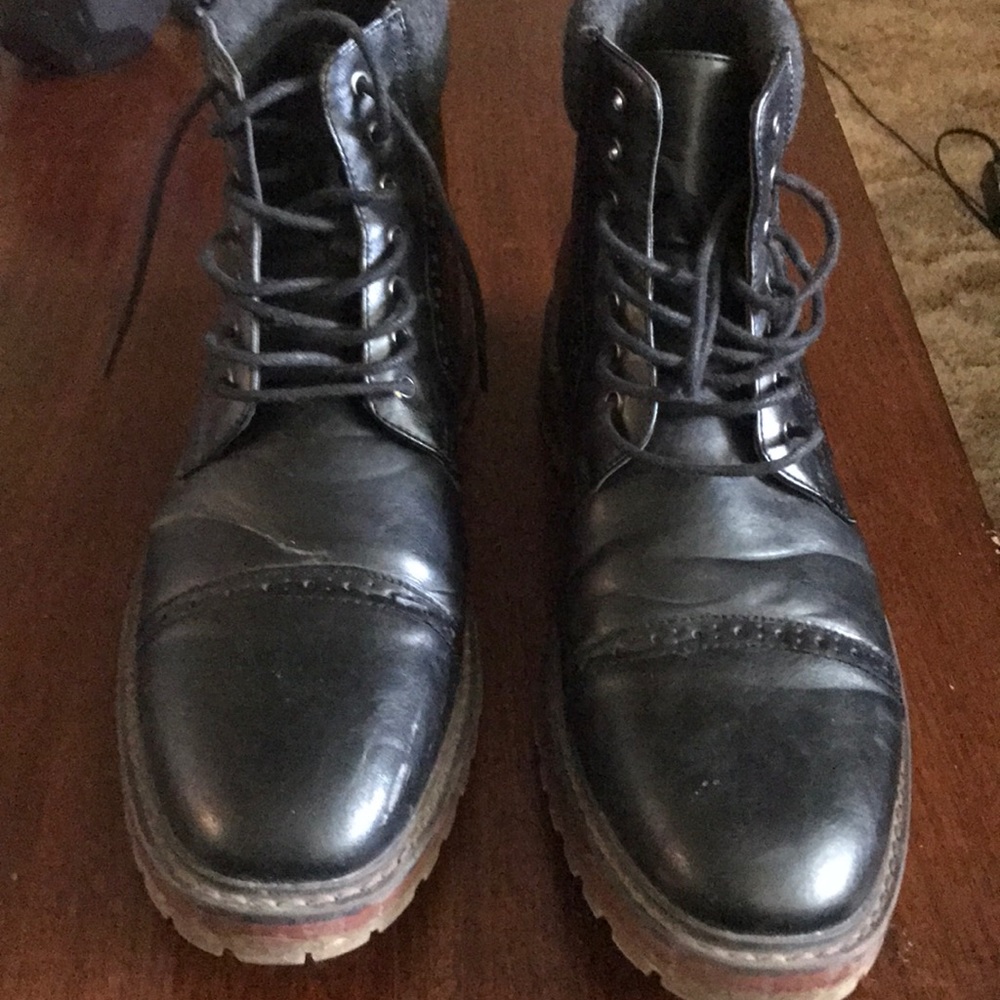 Black leather boots with stitching